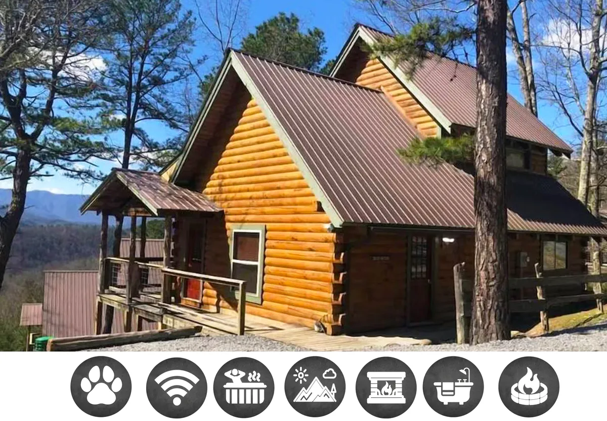 This exterior image showcases a charming log cabin nestled among lush trees with the majestic Smoky Mountains rising in the background. A welcoming porch invites guests to sit and enjoy the tranquil scenery, perfect for relaxing with morning coffee or stargazing at night. The natural surroundings evoke peace and privacy, setting the stage for mountain adventures or serene escapes.